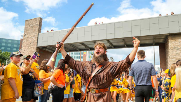 Sep 9, 2023; Morgantown, West Virginia, USA; The West Virginia Mountaineers mascot leads the Mantrip as players arrive before their game against the Duquesne Dukes at Mountaineer Field at Milan Puskar Stadium. Mandatory Credit: Ben Queen-USA TODAY Sports
